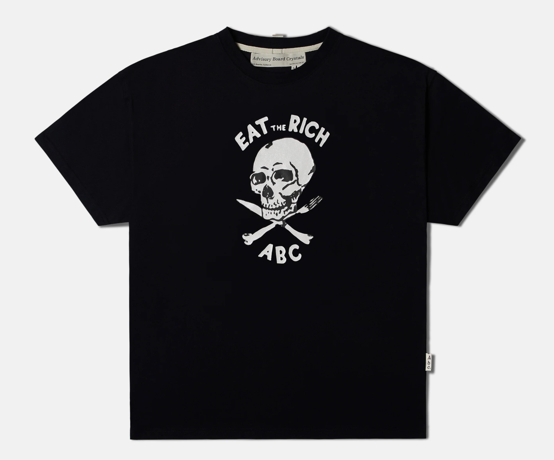 A T-shirt with a bold graphic of a skull and crossed cutlery beneath the slogan “Eat the Rich” and ABC branding